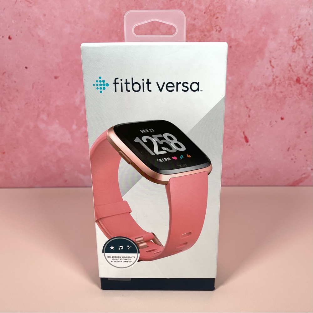 Fitbit Versa: Like New Condition, :Rose Gold Case, Peach Bands, Charger and Box.